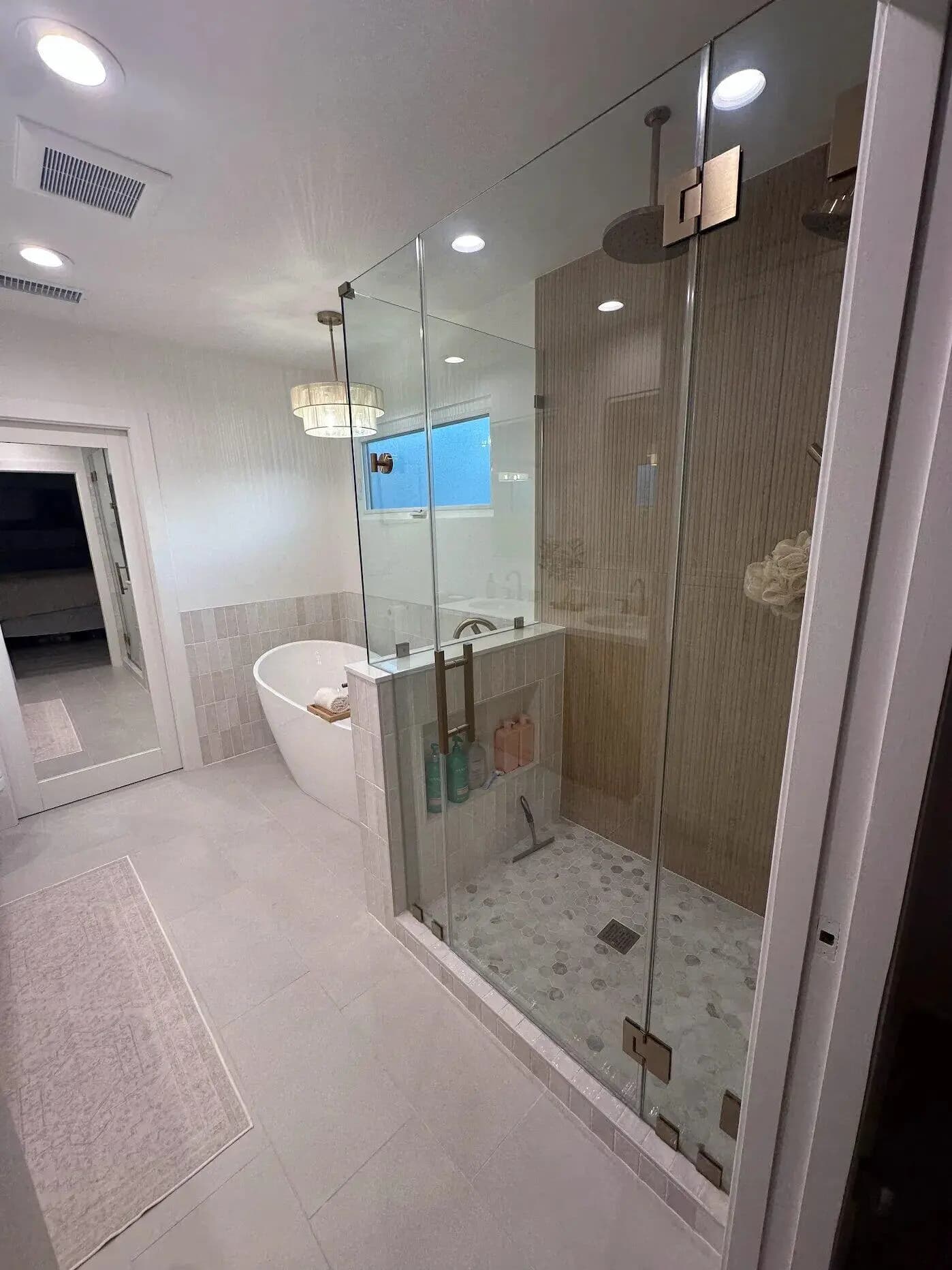 Custom vanity with built-in storage cabinetry and premium finish details in Long Beach master bathroom
