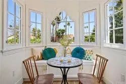 Breakfast nook with arched windows and bench seating
