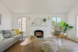 Light-filled living room with restored fireplace